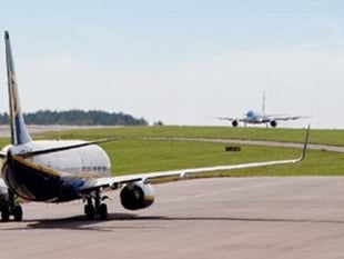 Two men charged after causing disruption at Bristol Airport