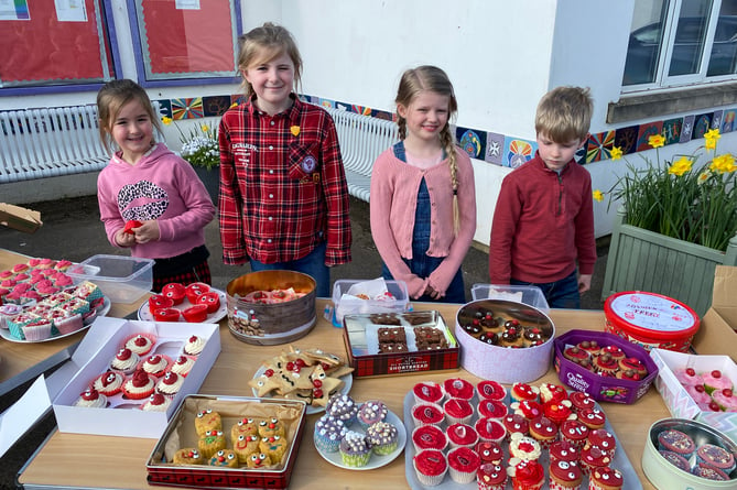 St John Primary School pupils dressed all in red and sold cakes to raise much-needed money for Comic Relief. 