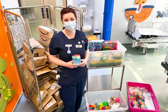 Paediatric Emergency Sister Sarah Potter with some of the donations.