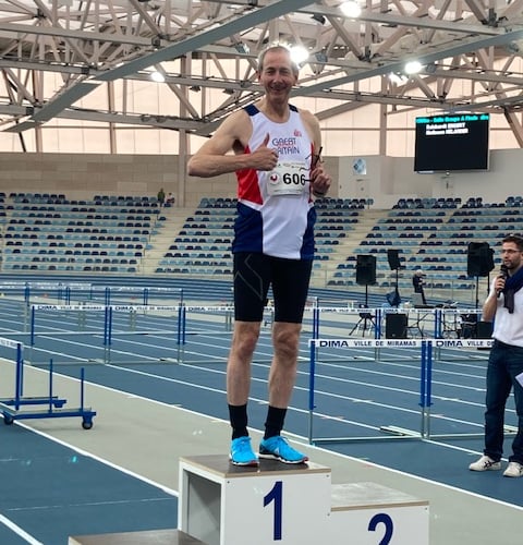 Jerry Musselwhite winning the Best Performance Trophy at the Championships for 3,000m.