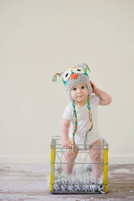 Baby standing on the floor.