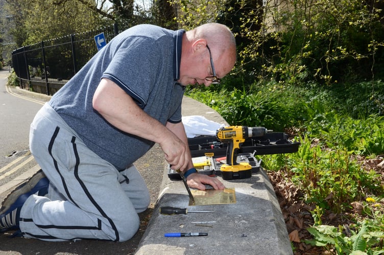Chairman of the Branch, Martin Feeney, fixed the plaque into position.