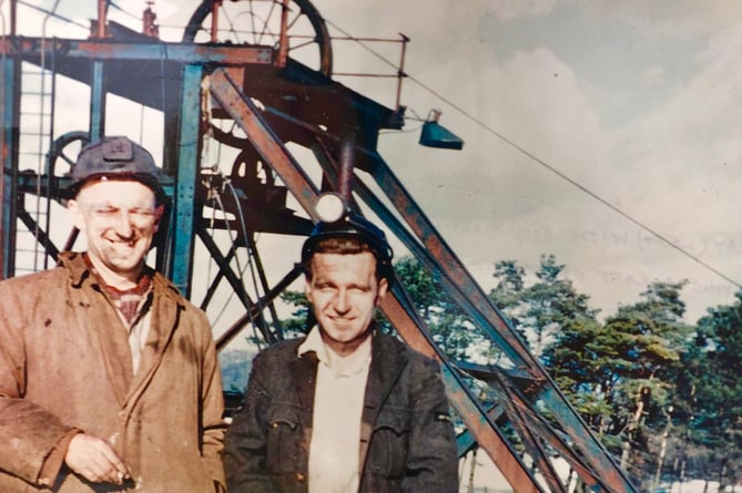 Ray Ashman, right, at Mendip (formerly Strap) Colliery around 1954. The man beside him is the deputy of Mendip Colliery. The winding headgear in the photo is a temporary structure being used when the pit was being inspected and pumped. The winding engine house that replaced it, is still standing at Jackson’s Fencing although the winding gear no longer exists.