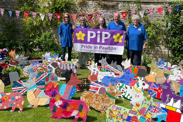 Members of Pride in Paulton stood behind the beautifully decorated Corgis.