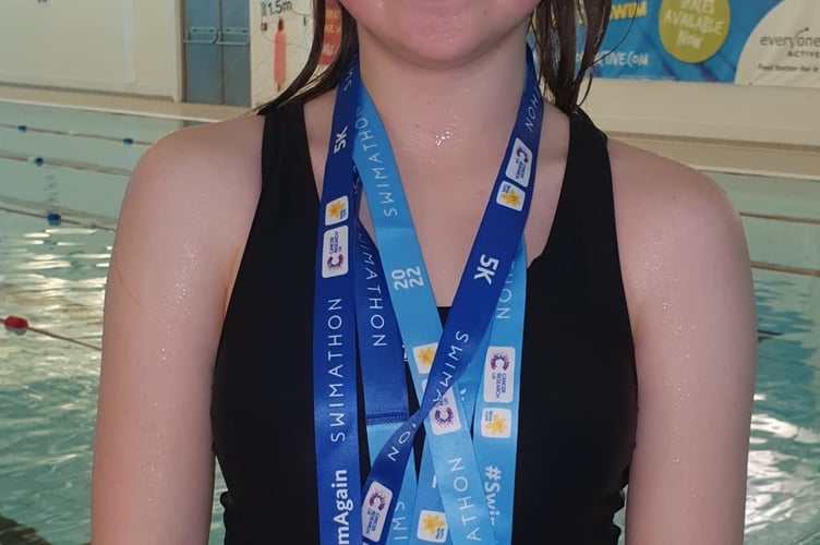 14-year-old Kezia completed a triple 5km swimathon in aid of charities.
