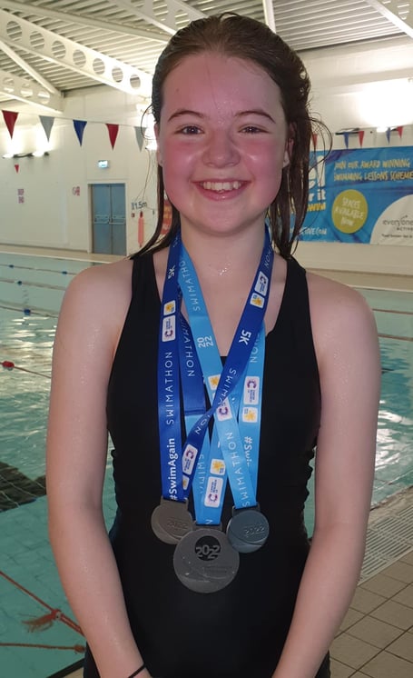 14-year-old Kezia completed a triple 5km swimathon in aid of charities.