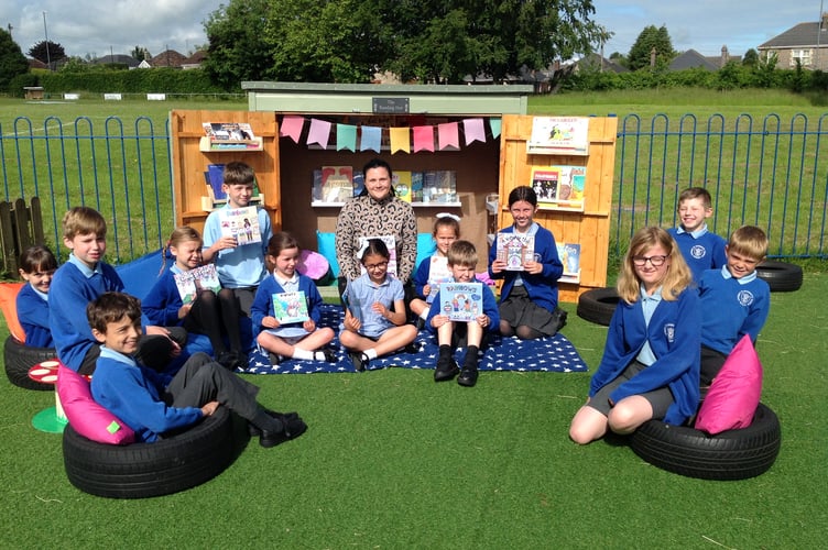 St Benedict’s School children promote reading in their new areas.