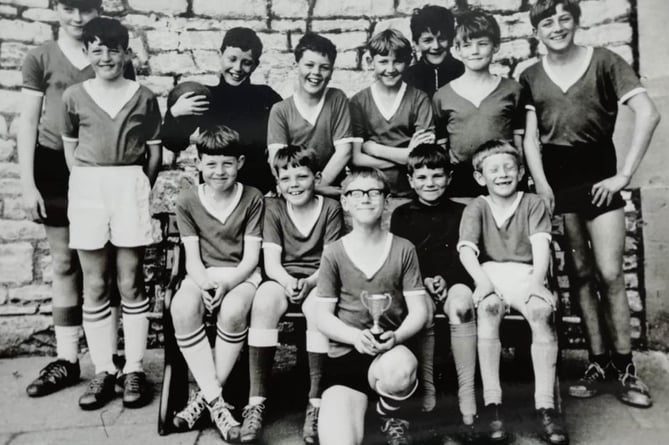 Norton Rangers pictured before cup final at Welton Rovers in 1968. Simon Wellington is in the middle holding the cup. Left to right from back: Keith Penny, Sean Mudeford, Paul Caswell, Nigel Wilcox, Brian Gibbs, G. Jones, Steven Green, Robin Gibbs. Front: J. Mudeford, Nigel Kertin, Simon Wellington, Paul Matthews, Jonathan Wellington.