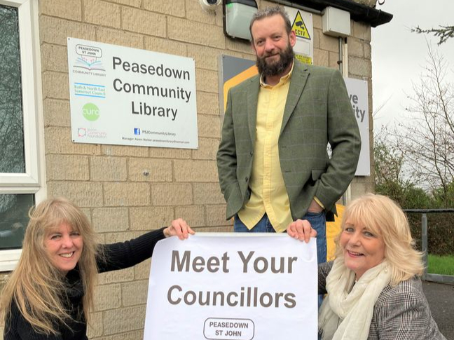 Cllr Sarah Bevan (left) and Cllr Karen Walker (right) with Gavin Heathcote outside the Peasedown Community Library.