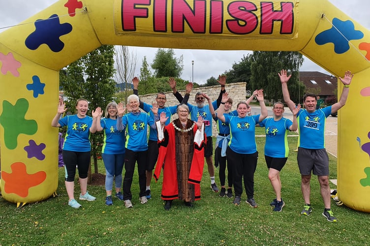 Midsomer Norton Mayor Lynda Roberston stood with Welton Church runners who took part in the Midsomer Norton Town Park Community 5k.