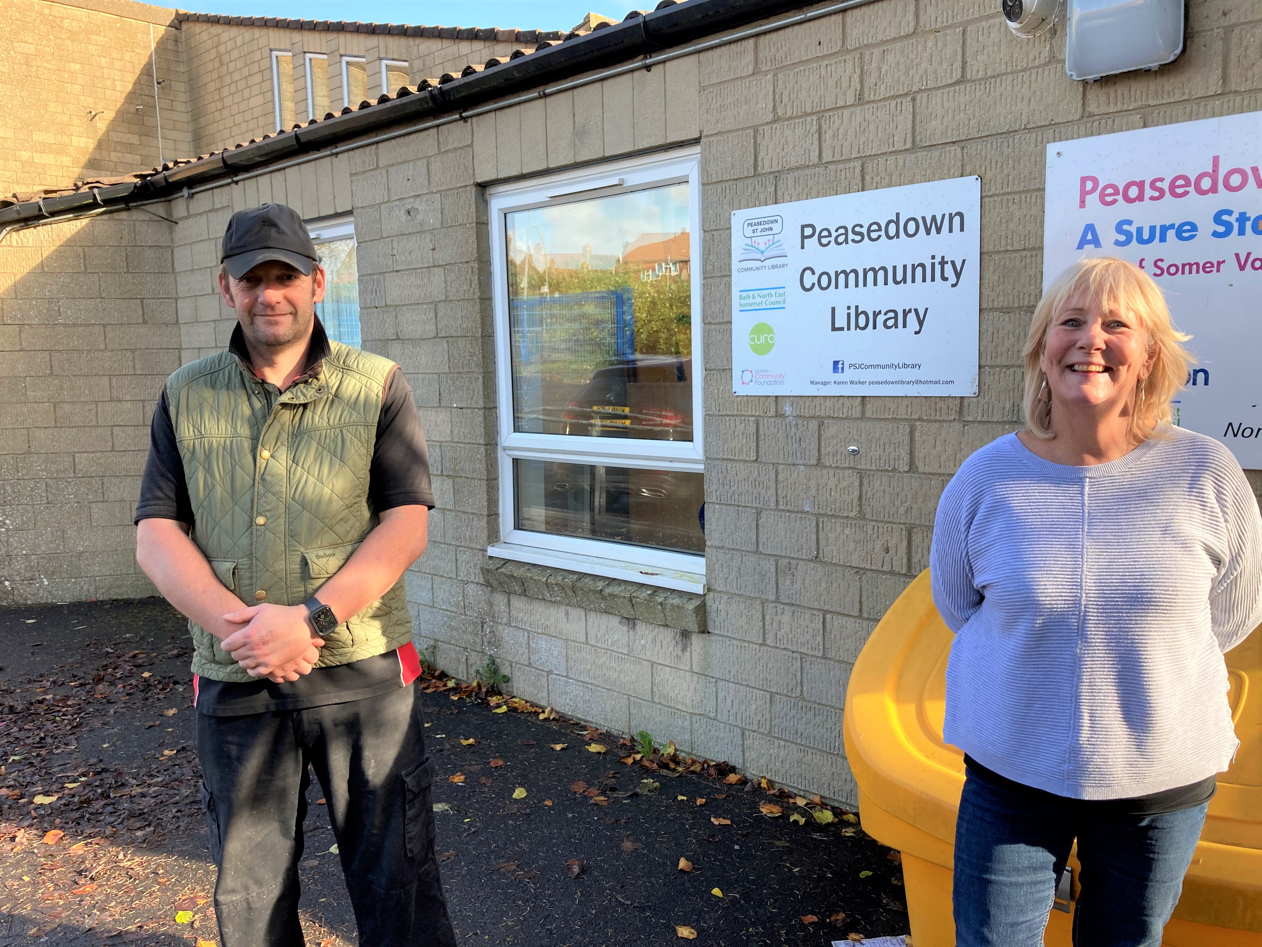 Gavin Heathcote and Cllr Karen Walker outside Peasedown St John Community Library.