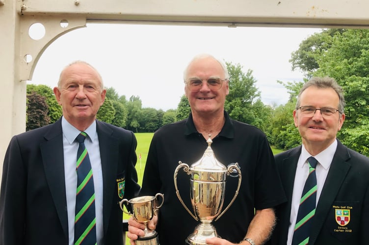 Malcolm Terry being presented with the Cole and Dalby Cups for winning both Senior Mens’ championships by Philip Spring and Andy Williams.