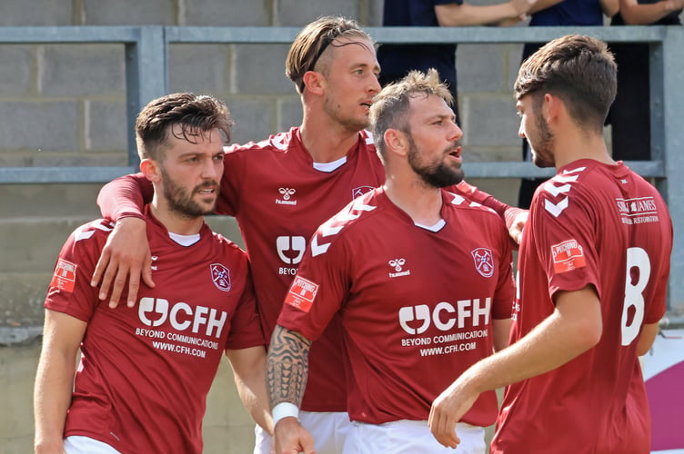 Paulton Rovers players celebrate one of five goals they scored against Bideford on Saturday.