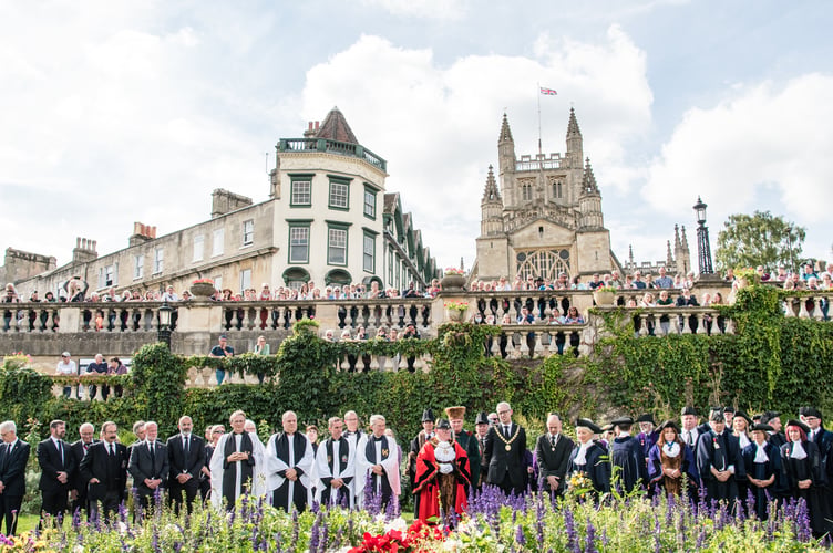 The public and The Chair of Bath & North East Somerset Council, Cllr Shaun Stephenson-McGall, is pictured making the proclamation on the steps of the Guildhall on Sunday.