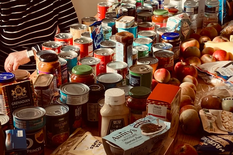 Liz Hardman stood with a table full of donated goods set for Paulton Larder.