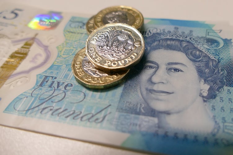 Pound notes and coins.