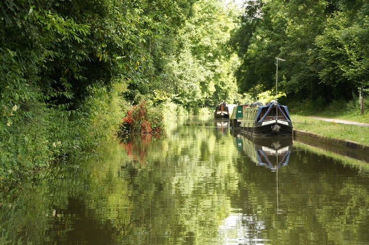 Boats line along idyllic canal