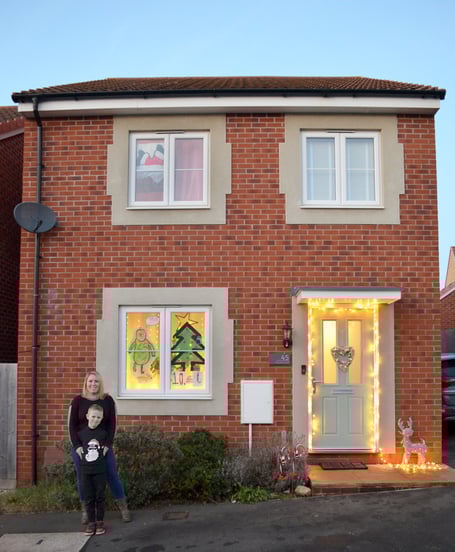 Gemma Carroll and her son Jake stood outside their house.
