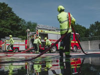 Fire crews tackle blazing car in middle of field near Frome