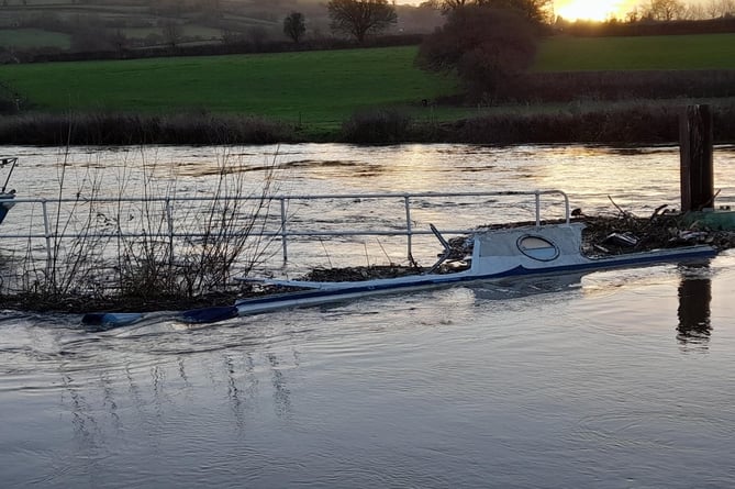 A sunken boat in the River Avon, Saltford. 