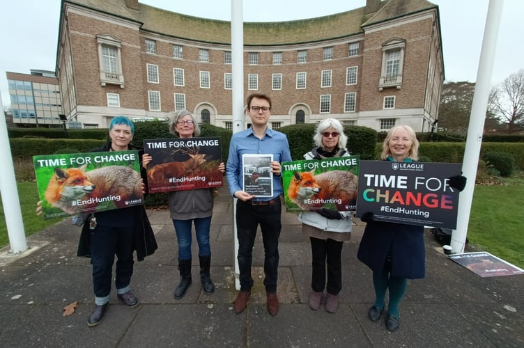 League Against Cruel Sports public affairs officer Jac Freeman (blue shirt in centre) and League campaigners handing in the letter and report at County Hall in Taunton today. 