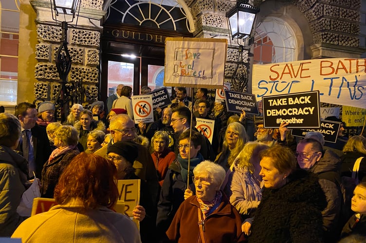 Liz Hardman addresses protestors from the 82 bus outside the Guildhall.