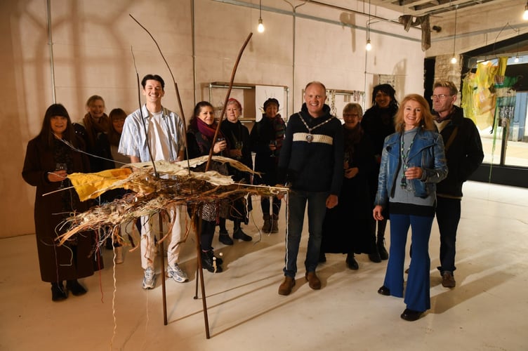Fiona Campbell with others amongst her piece of art.
