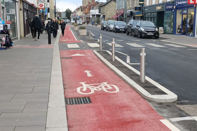 The red-painted cycle lane on Keynsham High Street.