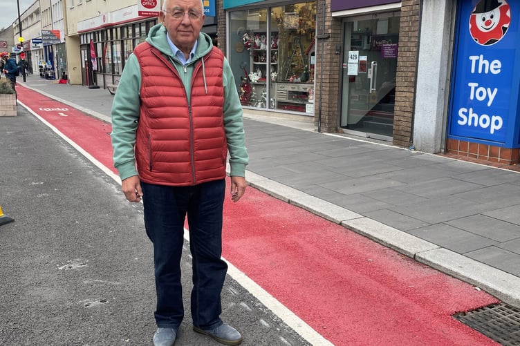 Keynsham South councillor Alan Hale by the cycle lane on Keynsham High Street.