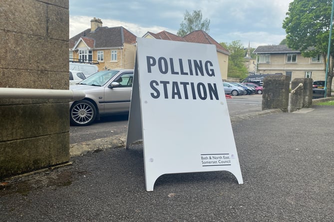 A polling station sign.