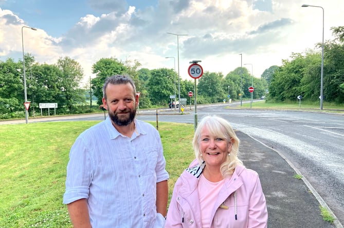 Cllr Gavin Heathcote (left) and Cllr Karen Walker (right) at A367/Bath Road junction where a new roundabout is to be built.