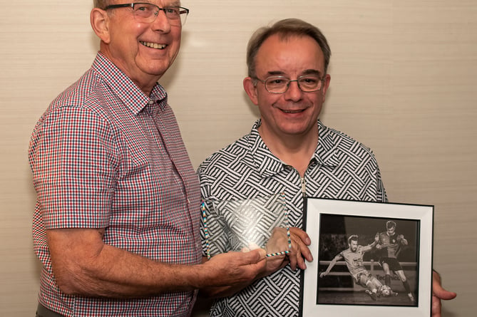John Newport, photographer at Radstock Town Football Club, received a recognition award for his winning photograph.