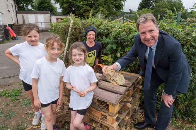 Licensed to West Of England Combined Authority for press and PR use.Pensford, Somerset, UK; 30/06/2023;West of England Metro Mayor Dan Norris is shown a bug hotel at Pensford Recreation Ground. Conservation Volunteers in Pensford are teaching local children 'bug-friendly' actions such as making bug hotels as part of a Bugs Matter project which includes a survey of bugs and a CA-funded pollinator garden of wild flowers at the recreation ground.Photo credit: Simon Chapman©Simon Chapman 2023.  All Rights Reserved.Simon Chapman asserts his Moral Rights as the author of this work in accordance with the Copyright Designs and Patents Act 1988.Contact photographer: Simon Chapman07889 747916; simonchapmanpix@gmail.com