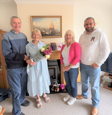  Sue and Eddie Eades are presented with a bouquet of flowers by Cllr Karen Walker and Cllr Gavin Heathcote.