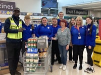Tesco team helps stock community fridge