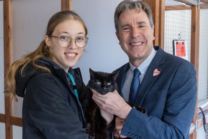 Mayor Norris at Bath College with Tosca the black cat and student Anna Colbourne.
