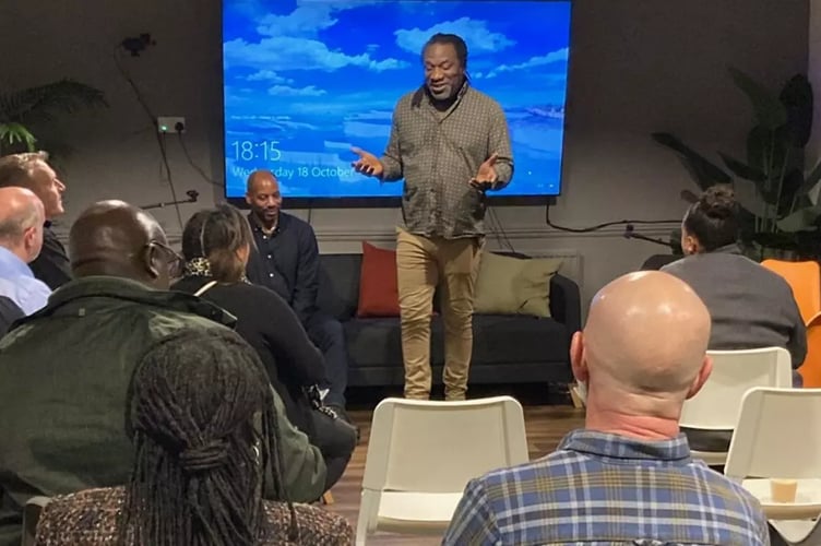 Bristol's first City Poet Miles Chambers talking to guests at the launch event for 'I want to be seen'