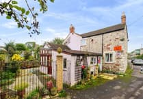 Character cottage for sale is 200 years old and sits beside a babbling brook 