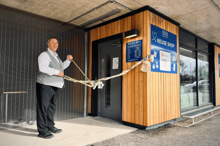 Councillor Tim Ball, cabinet member for Neighbourhood Services, Bath & North East Somerset Council, cutting the ribbon to open the Reuse Shop at Keynsham Recycling Hub.