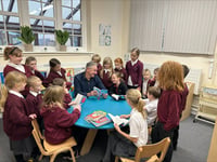 Renowned author opens school library and inspires pupils’ love for reading