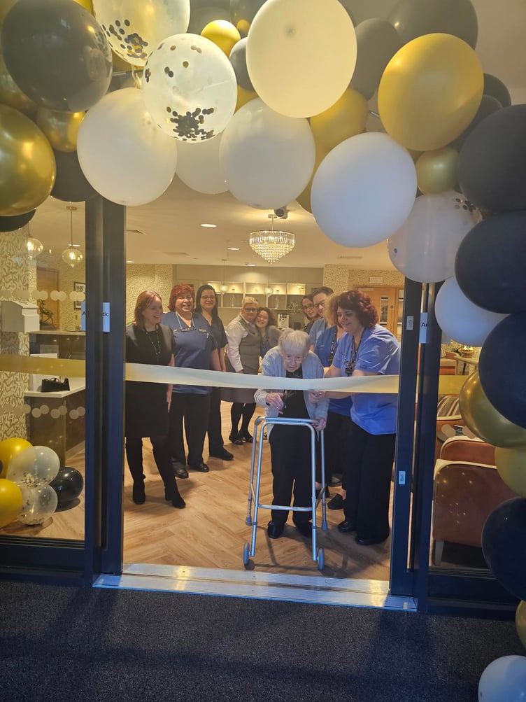 Photograph: Rowan Park resident, Mavis, opened the doors to the new care home.