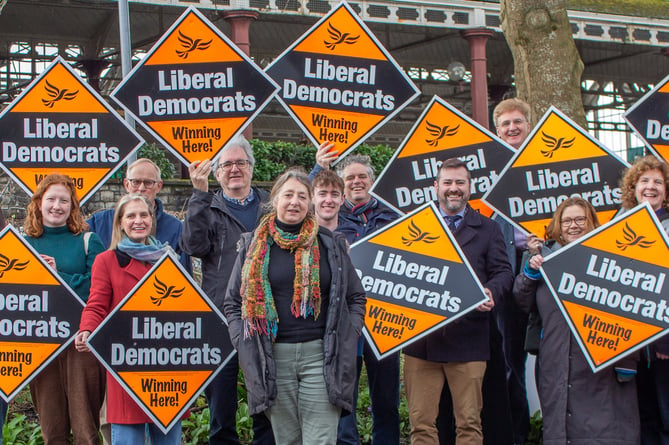 Dine Romero (centre) with Liberal Democrat supporters including Bath MP Wera Hobhouse (centre left) and Bath and North East Somerset Council leader Kevin Guy
