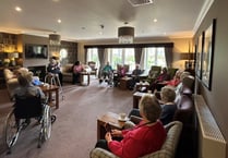 Local author discusses fond memories with care home residents