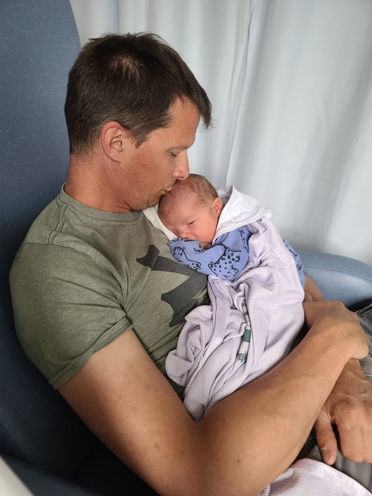 Jay with his baby. A man was diagnosed with cancer just two days after his third child was born. Jay Martin, 47, noticed a lump on his neck in March 2023 but thought it was a swollen gland until it started to get bigger. Two months later, in May 2023, just two days after his third child was born, he went to Musgrove Park Hospital, Taunton, Somerset, alongside his wife, Sarah, 38, to get it checked out. Doctors looked down Jay's throat and told him they suspected he had cancer in his tonsil with a biopsy later confirming the diagnosis.