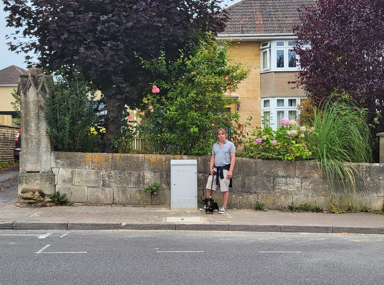 Sean Alexander with the 'eyesore' telecoms box (Image: Sean Alexander)