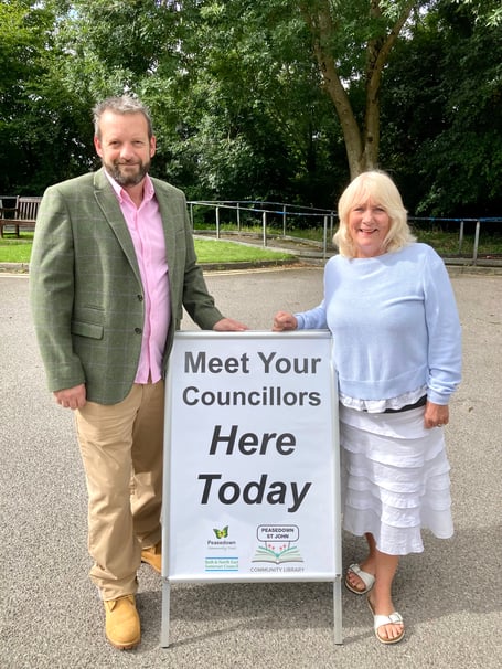 Cllr Gavin Heathcote (left) and Cllr Karen Walker (right) outside the Peasedown Community Library.