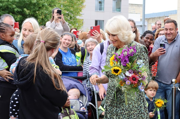 Riya Gowda, a pupil at a local school whose father is a consultant oncologist at the centre, presented a posy to the Queen.