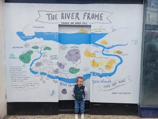Mural showing water cycle and River Frome links brightens vacant shop