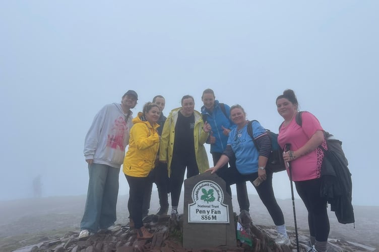 Team members reach the top of Pen-y-fan