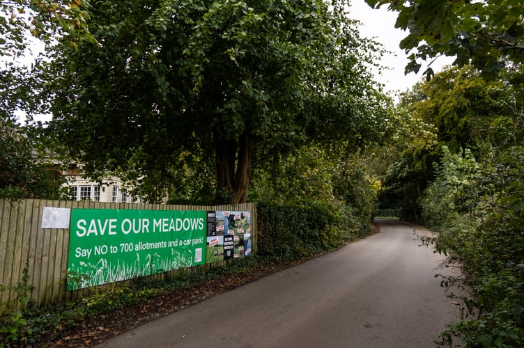 The 'worlds first no-dig' allotment community which has sparked fury from over 3,400 people, been slammed by Chris Packham and Deborah Meeden and has caused more controversy - by installing a driveway. Photo released October 3 2024. The 'world's first no-dig allotment' criticized by Chris Packham and Deborah Meaden has sparked more anger with local planners - over a new access road. More than 3,400 people have signed a petition against the Roots Allotment site on a field next to the A369 at Abbots Leigh village near Bristol. It plans to have 700 allotment plots - which will make the site one of the biggest in the country when completed. 'No dig' means growers plant into topsoil which has been placed on top of the ground so no soil is dug up, broken or turned.